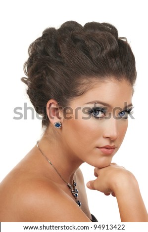 Young woman with beautiful make up, hairdo and sapphire diamond