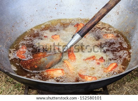 fried pork in oil pan