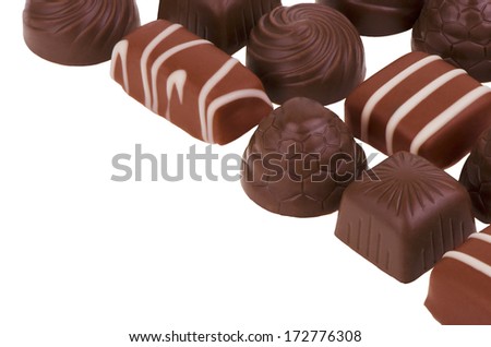 Various chocolate pieces isolated on white background.