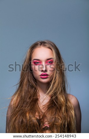Portrait of a beautiful girl with fluttering hair