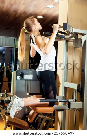 Gym triceps dips exercise workout woman indoor.