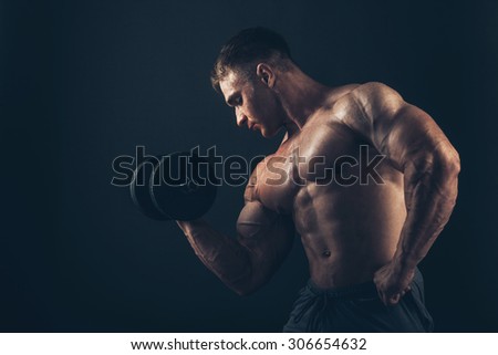 Muscle man doing bicep curls. Muscle man doing bicep curls