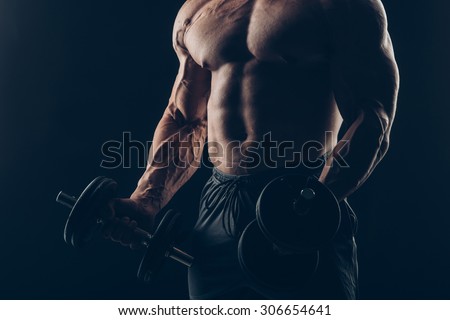 Muscle man doing bicep curls. Muscle man doing bicep curls