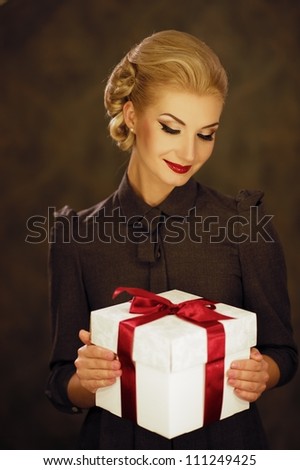 Retro woman with a gift box