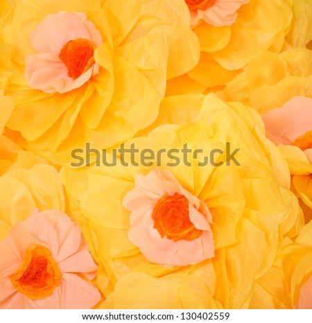 Handmade big yellow paper flowers background