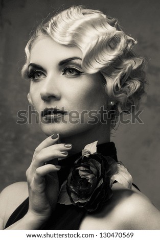 Monochrome Portrait Of Elegant Blond Retro Woman In Dress With Beautiful Rose Flower