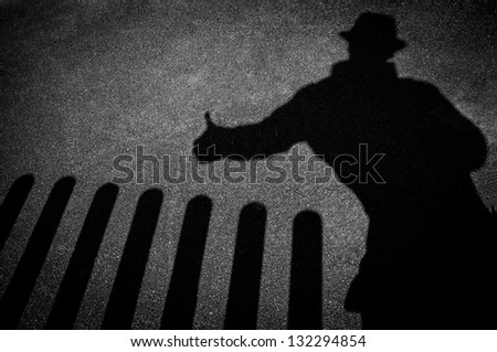 Strangers shadow on pavement