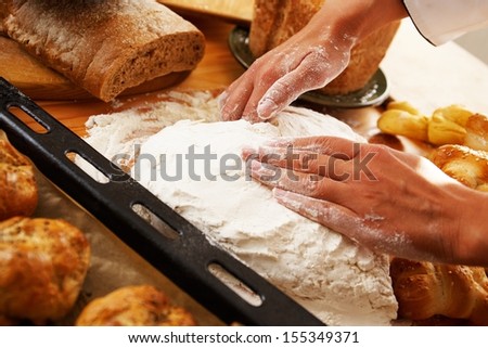 Cook hands preparing dough for homemade pastry