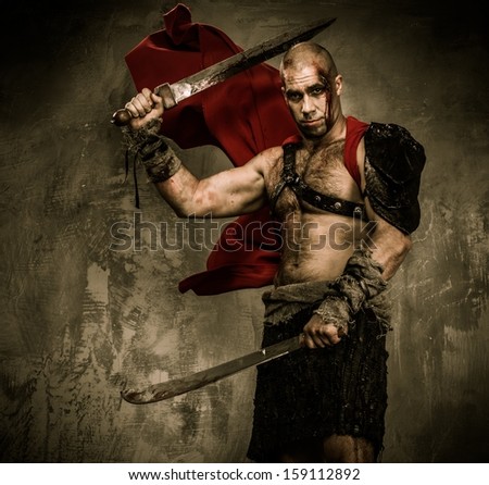 Wounded gladiator with two swords covered in blood