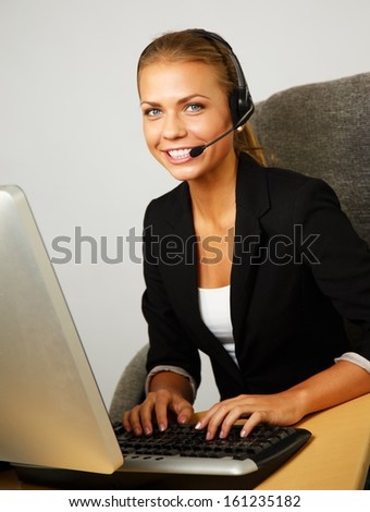 Beautiful help desk office support woman with headset