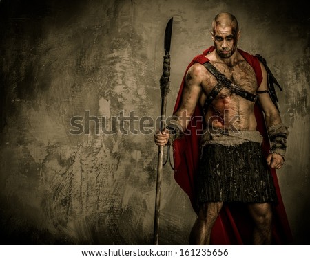 Wounded gladiator in red coat holding spear