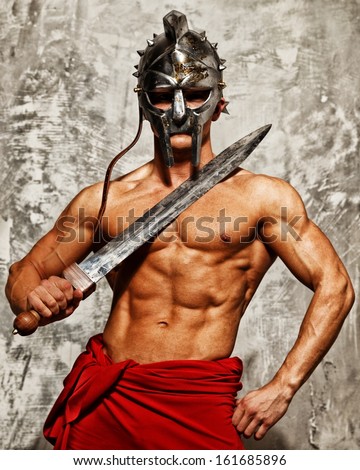 Gladiator With Muscular Body With Sword And Helmet