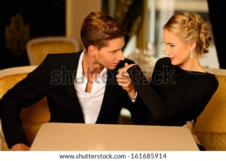 Well-Dressed Couple In Luxury Interior