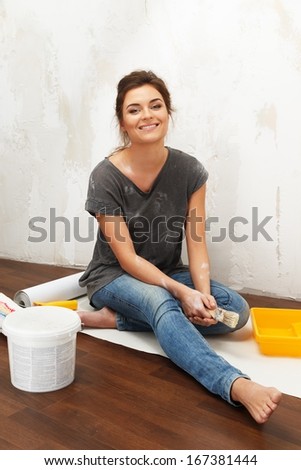 Happy Beautiful Young Woman Doing Wall Painting