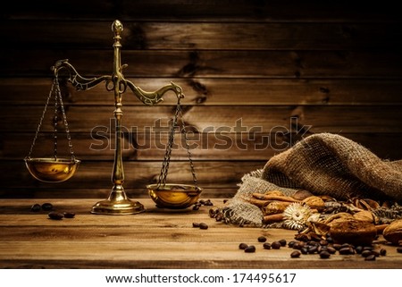 Coffee theme with brass scales still-life on wooden table