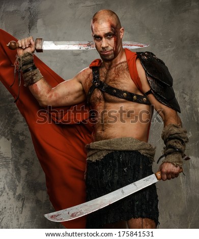 Wounded gladiator with  two swords covered in blood