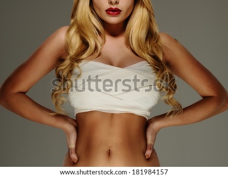 Young woman\'s beautiful body with bandage around her breast