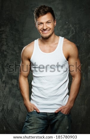 Stylish cheerful man in tank top shirt