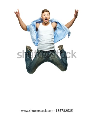 Funny man in blue shirt and jeans jumping