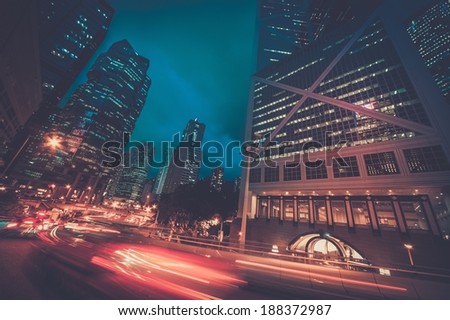 Fast moving cars at night in modern city