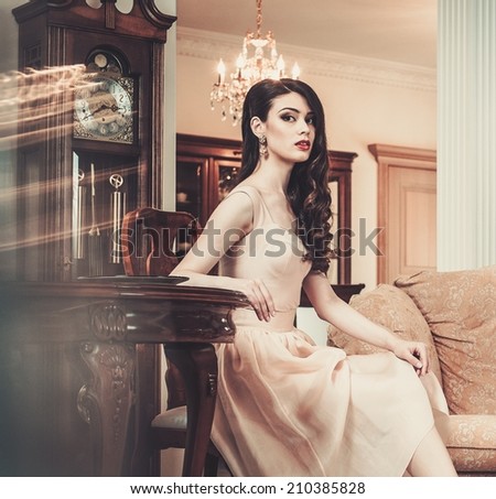 Beautiful young woman in luxury house interior