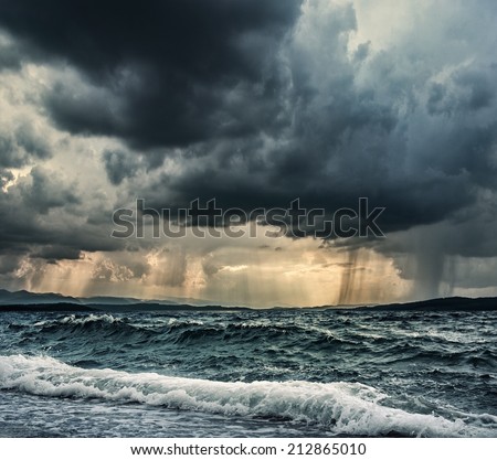 Heavy rain over stormy ocean