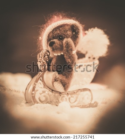 Small toy bear on a sleigh in christmas still life