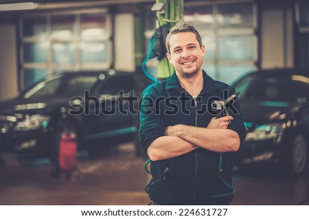 Cheerful man on a car wash