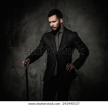 Handsome well-dressed with walking stick
