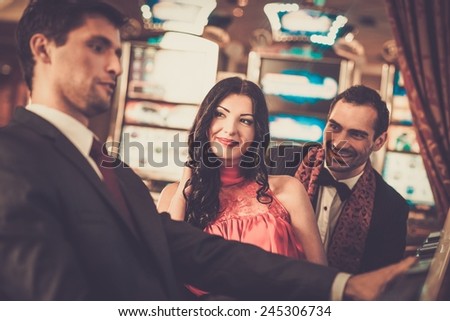 People near slot machine in a casino