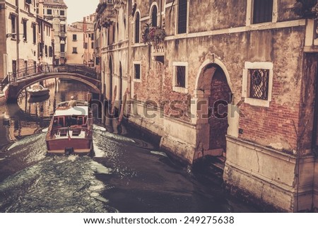 People on a boat riding in Venice