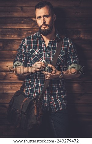 Man with messenger bag and camera