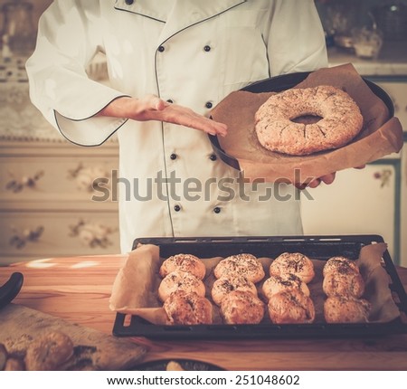 Cook hands holding homemade baked goods
