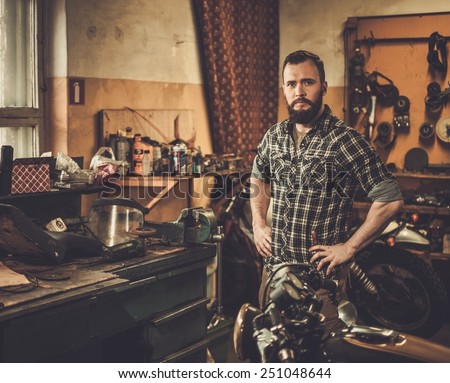 Mechanic in motorcycle custom garage