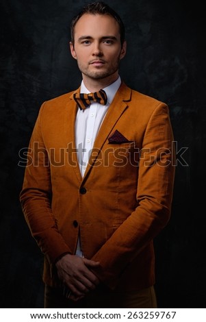 Sharp dressed fashionist wearing jacket and bow tie