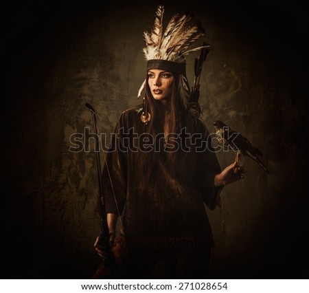 Indian woman hunter with bow and pet hawk