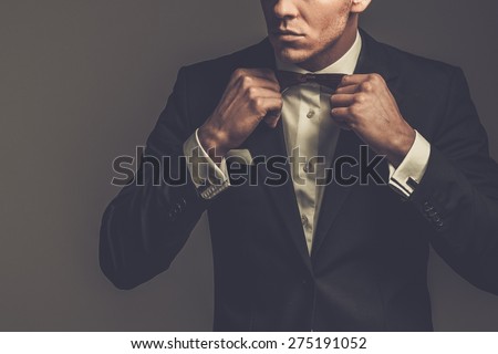 Sharp dressed man wearing jacket and bow tie