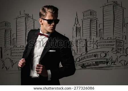 Sharp dressed man in black suit against city panorama drawing