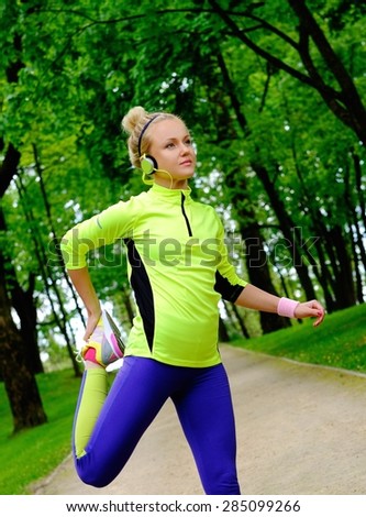 Woman doing stretching exercise before running