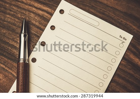 Luxurious rollerball pen and empty to do list