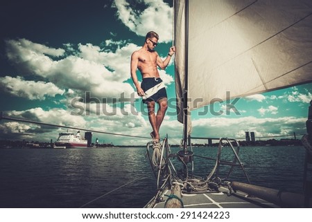 Handsome man on a regatta