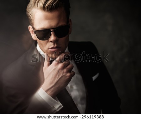 Tough sharp dressed man in black suit