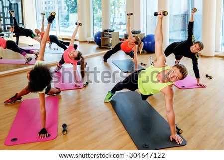 Multiracial group during aerobics class