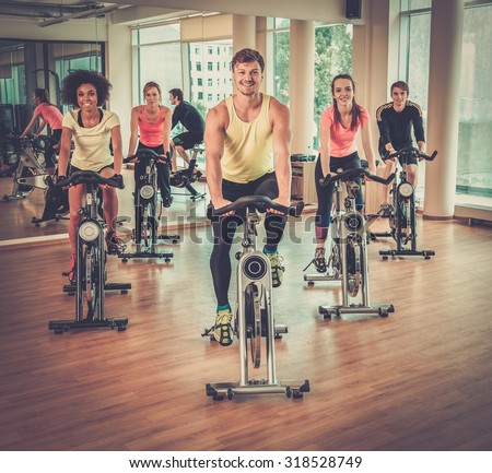 Multiracial group during aerobics class on a bicycles