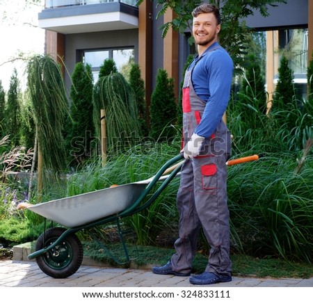 Gardener with tools in garden