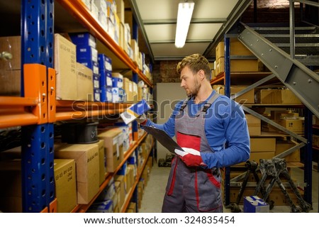 Worker on a automotive spare parts warehouse