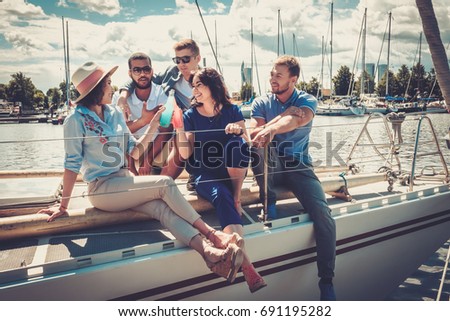 Happy friends resting on a yacht