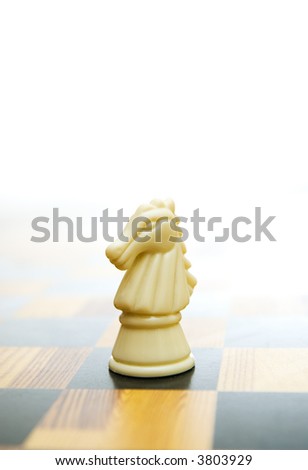 Knight figure on chessboard