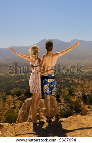 An attractive couple relaxing in high mountains