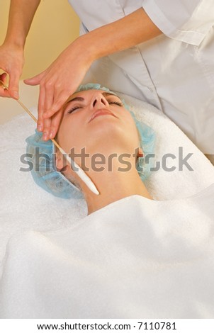 Facial cryogenic massage in spa salon